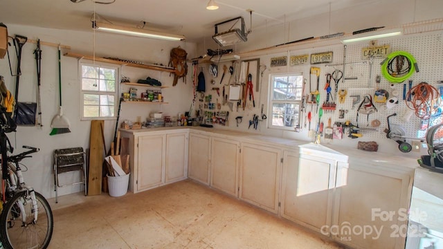 kitchen with light countertops, plenty of natural light, and open shelves