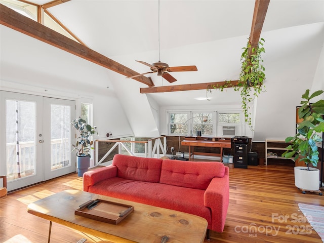 living room with high vaulted ceiling, beamed ceiling, hardwood / wood-style flooring, ceiling fan, and french doors