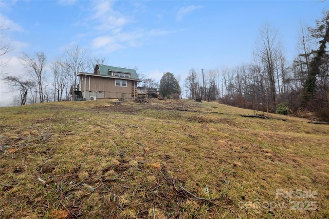 view of yard with a rural view