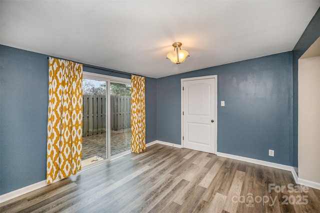 unfurnished room featuring hardwood / wood-style flooring