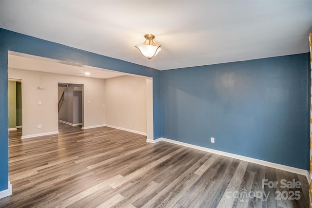 spare room with hardwood / wood-style flooring