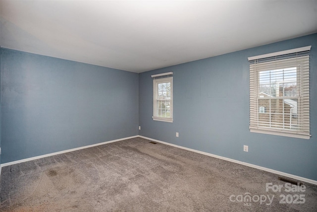 empty room featuring carpet flooring