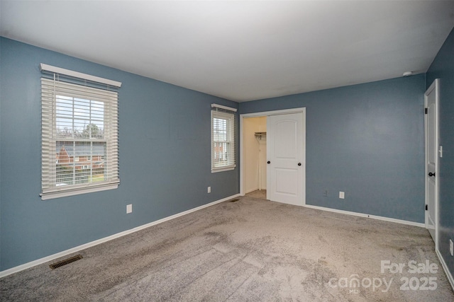 unfurnished room with carpet