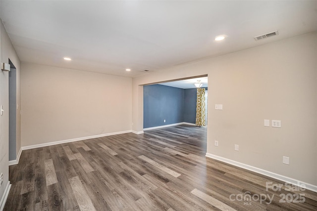 empty room with dark wood-type flooring