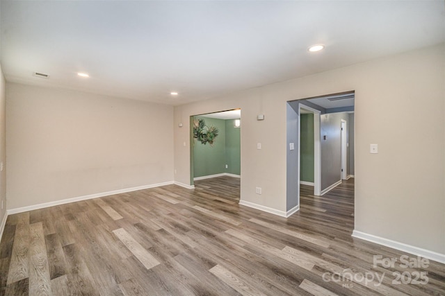 spare room featuring hardwood / wood-style flooring