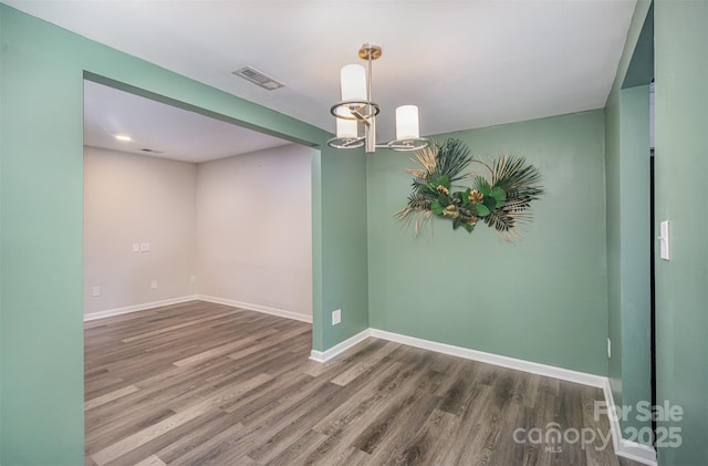 empty room featuring hardwood / wood-style flooring