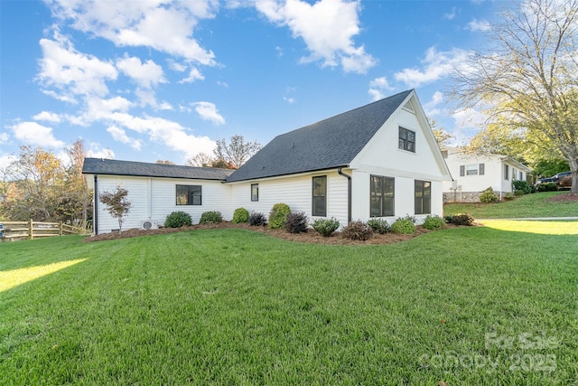 rear view of house with a lawn