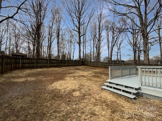 view of yard with a wooden deck