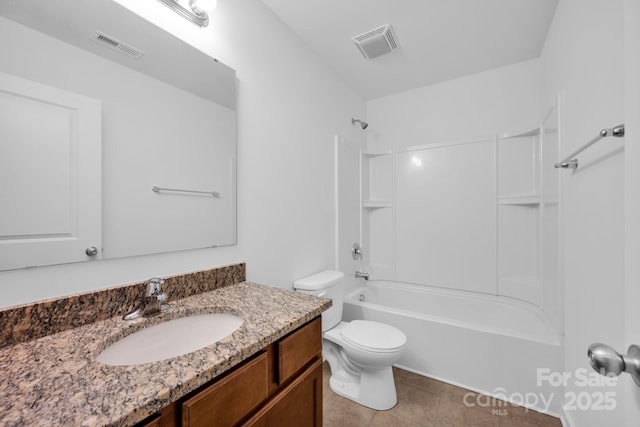 full bathroom with vanity, tile patterned floors, toilet, and shower / bath combination