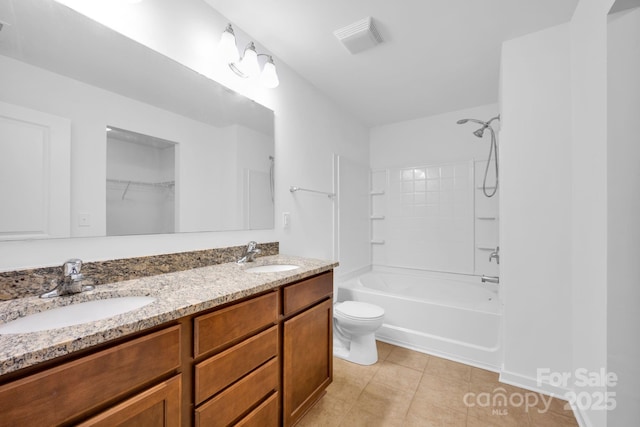 full bathroom featuring tile patterned flooring, bathing tub / shower combination, vanity, and toilet