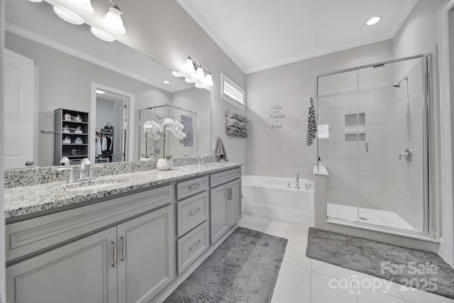 bathroom featuring tile patterned flooring, a shower stall, a walk in closet, and crown molding