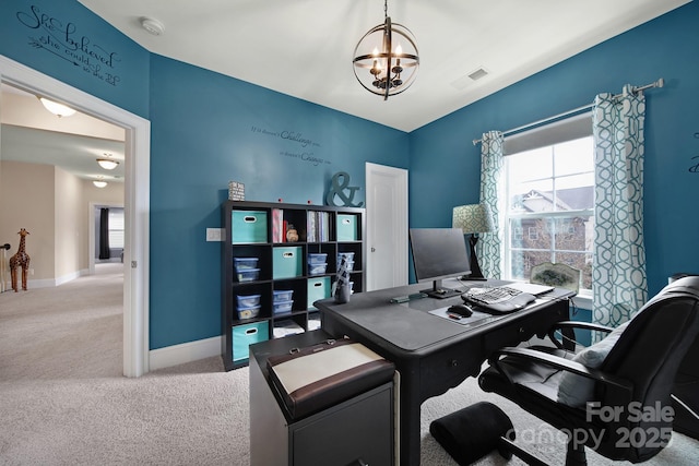 home office with an inviting chandelier, baseboards, visible vents, and carpet flooring