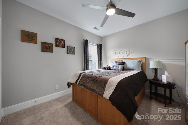 bedroom with baseboards, a ceiling fan, visible vents, and light colored carpet