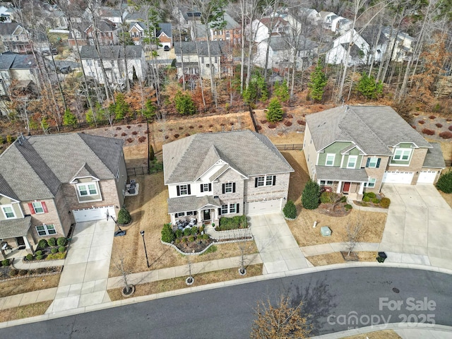 birds eye view of property with a residential view