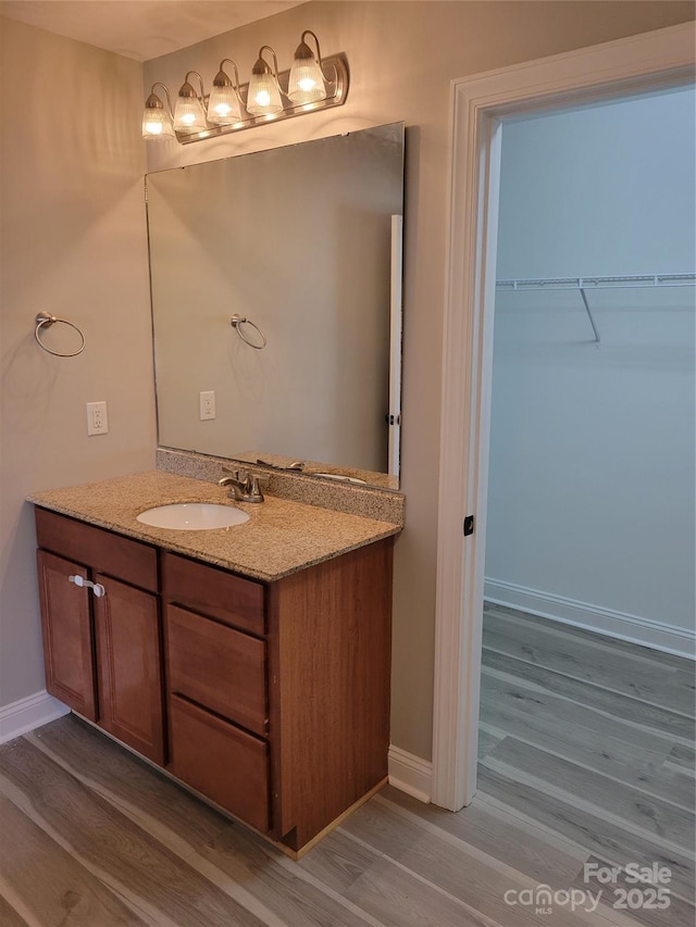 bathroom featuring vanity and hardwood / wood-style floors