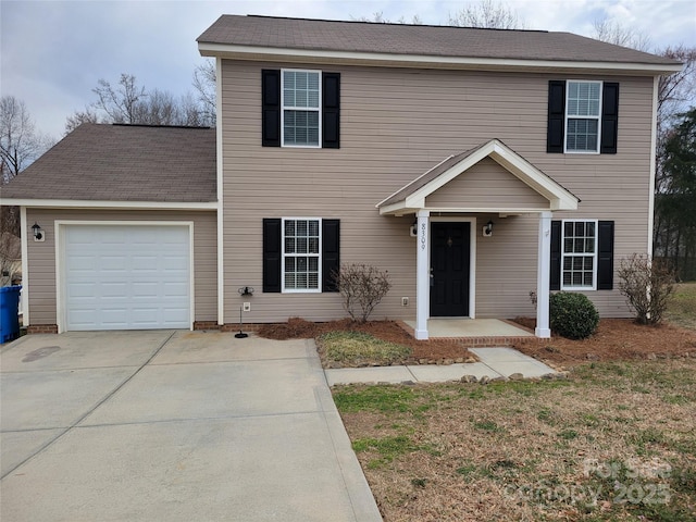 view of front of home featuring a garage and driveway