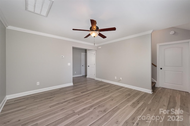 empty room featuring visible vents, crown molding, baseboards, light wood-type flooring, and a ceiling fan