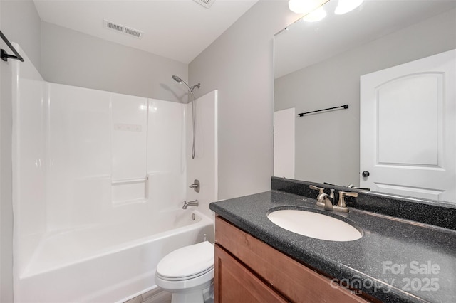 bathroom with visible vents,  shower combination, toilet, and vanity