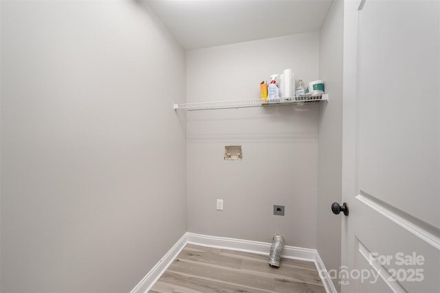 washroom featuring washer hookup, laundry area, baseboards, electric dryer hookup, and wood finished floors