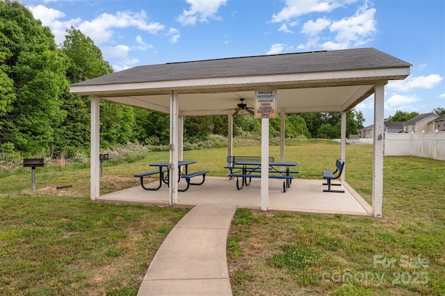 surrounding community featuring fence, a gazebo, a yard, and a patio area