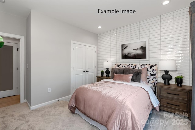 bedroom with a closet and light colored carpet