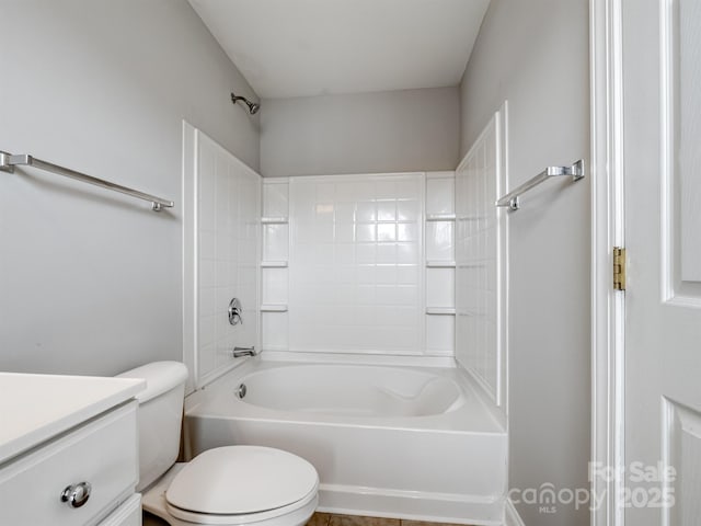 bathroom with shower / washtub combination, vanity, and toilet