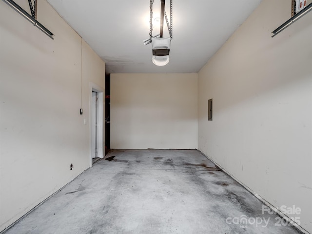 garage featuring a garage door opener and electric panel