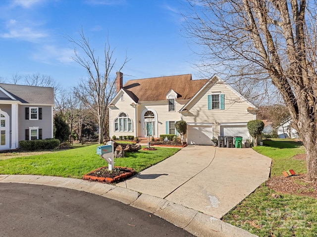 view of front of property featuring a garage and a front lawn