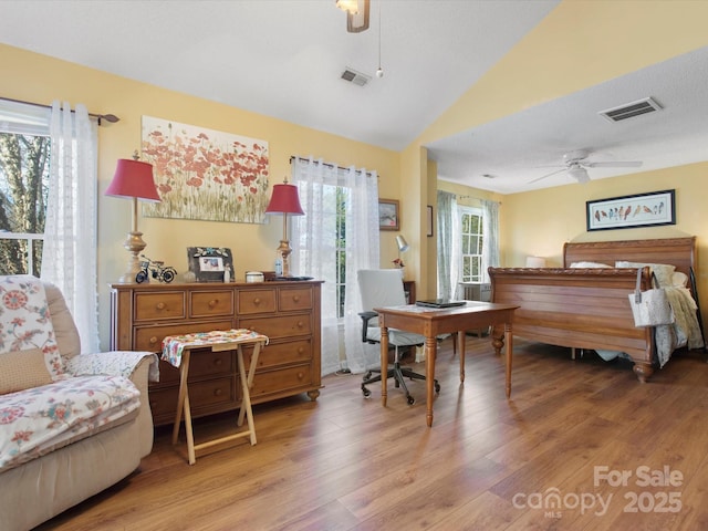 bedroom featuring vaulted ceiling and light hardwood / wood-style floors