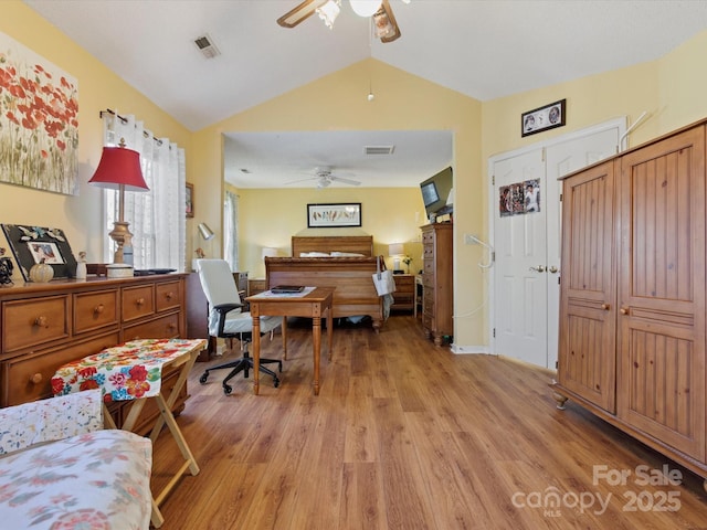 office with vaulted ceiling, ceiling fan, and light hardwood / wood-style floors