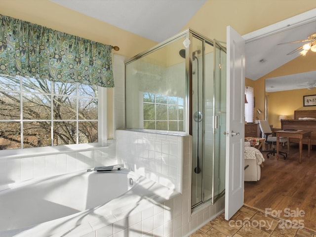 bathroom with vaulted ceiling, wood-type flooring, ceiling fan, and plus walk in shower