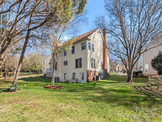 view of side of property with a lawn