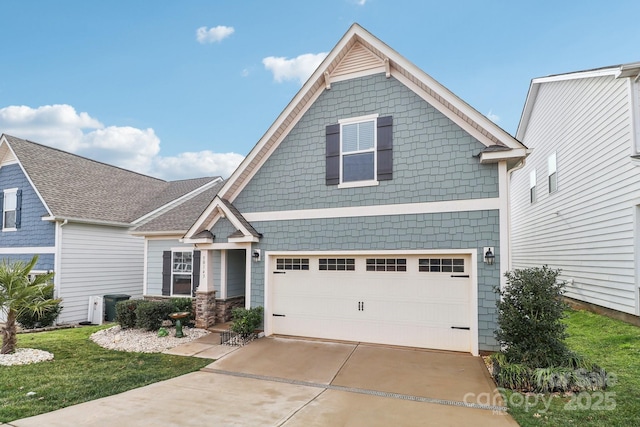 craftsman-style home featuring a garage and a front lawn