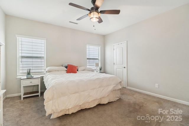 carpeted bedroom with ceiling fan