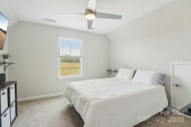 bedroom featuring ceiling fan, vaulted ceiling, and carpet