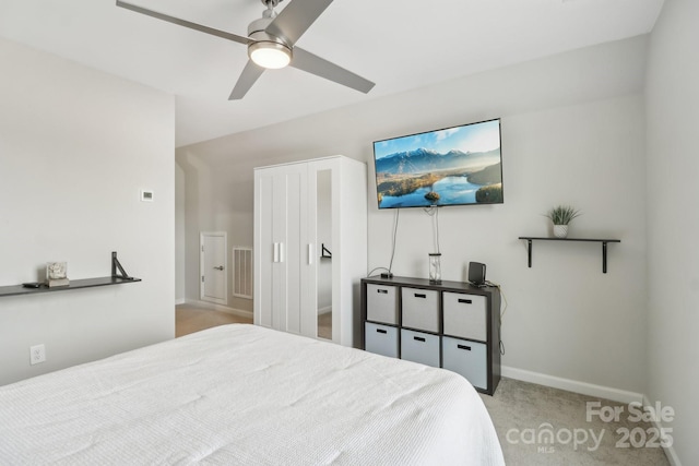 carpeted bedroom featuring ceiling fan