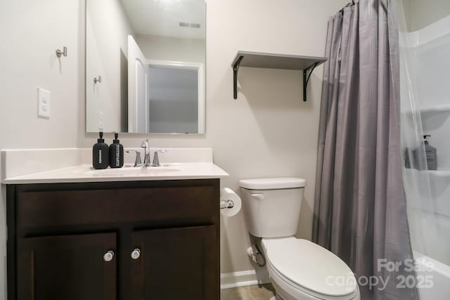 full bathroom featuring vanity, shower / tub combo with curtain, and toilet