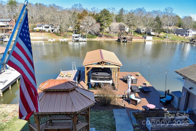 view of dock featuring a residential view and a water view