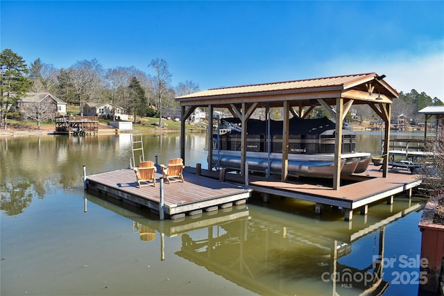 view of dock featuring a water view and boat lift