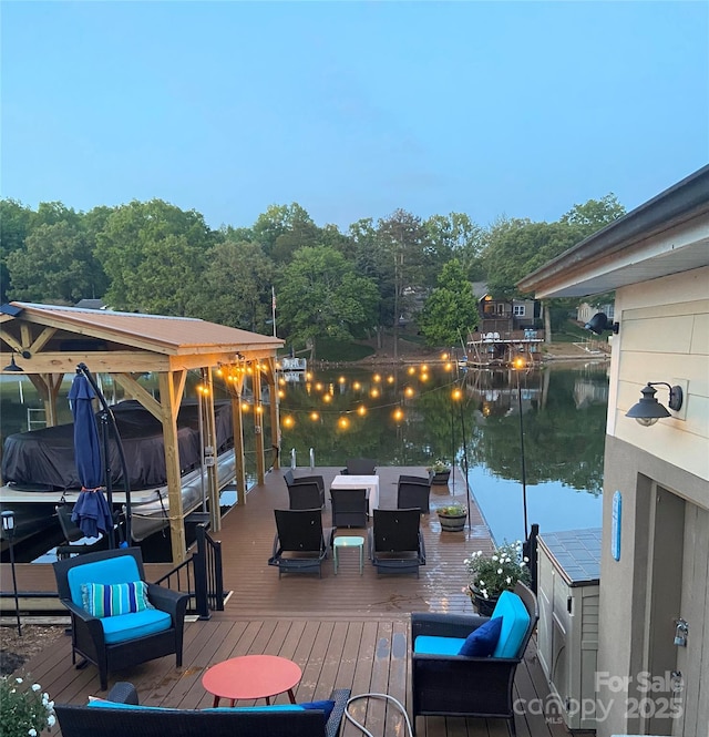 wooden deck featuring a water view