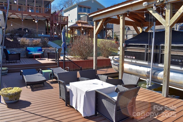 view of dock featuring outdoor lounge area and boat lift