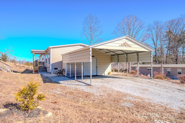 exterior space featuring a carport