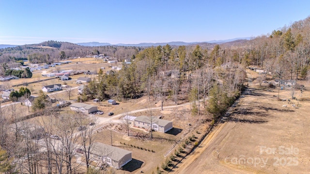 drone / aerial view featuring a mountain view