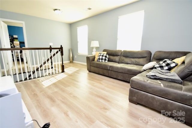 living room with light hardwood / wood-style flooring