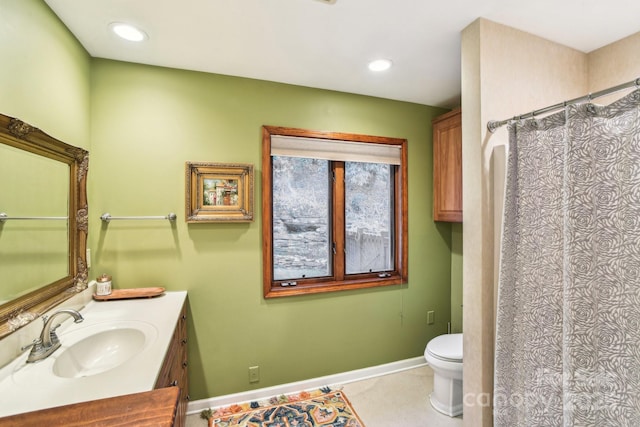 full bath featuring toilet, recessed lighting, vanity, baseboards, and tile patterned floors