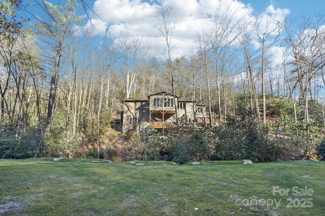 view of yard with a forest view