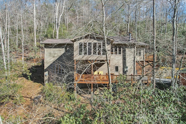 back of property with a wooden deck