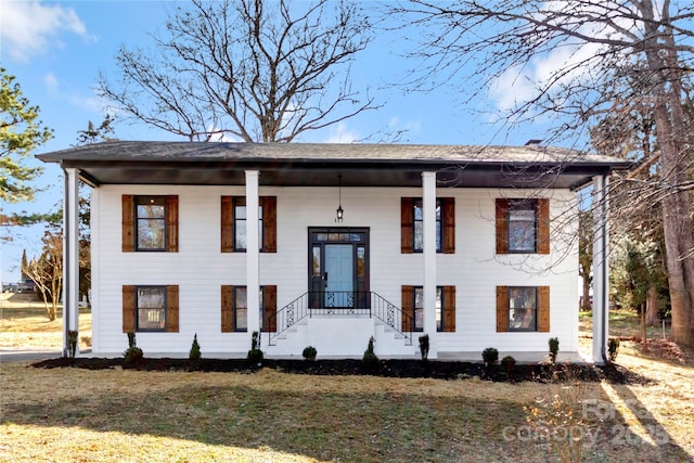 bi-level home with a front lawn