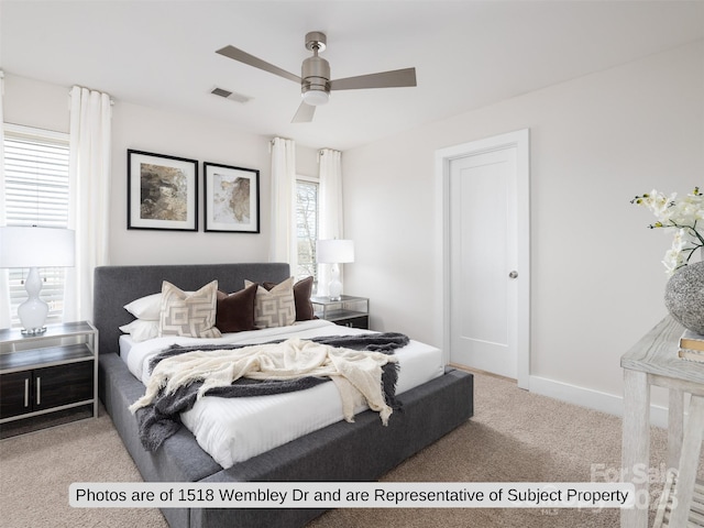 bedroom with light carpet and ceiling fan