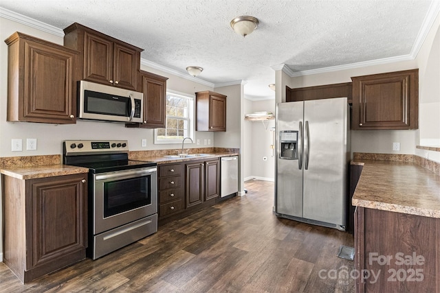 kitchen featuring sink, stainless steel appliances, crown molding, dark wood-type flooring, and a textured ceiling